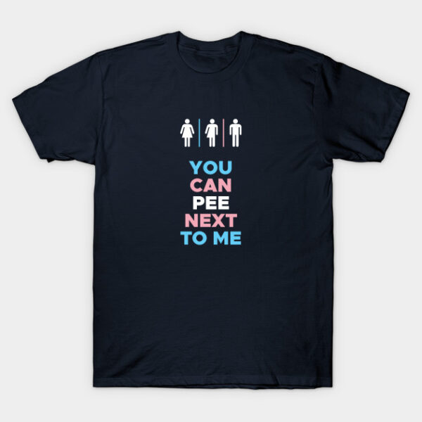 Navy blue t-shirt featuring the words you can pee next to me and male, female, and in-between bathroom symbols in the colors of the transgender flag.